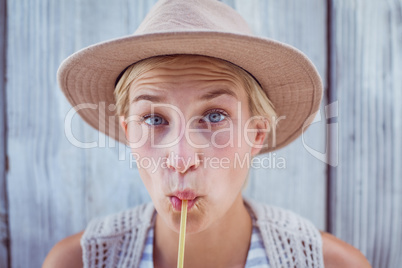 Pretty blonde woman drinking orange juice