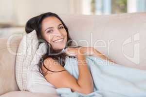 Pretty brunette relaxing on the couch