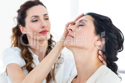 Therapist hypnotizing her patient
