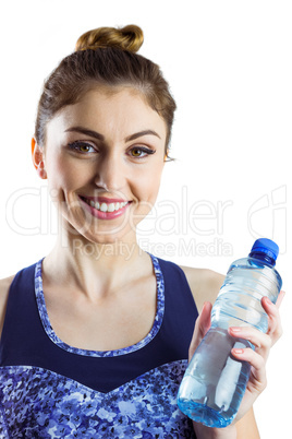 Fit brunette holding water bottle