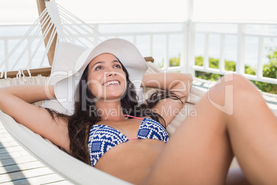 Pretty brunette relaxing on a hammock