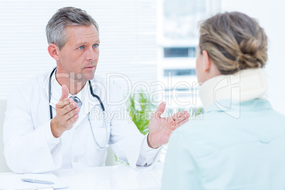 Doctor having conversation with his patient