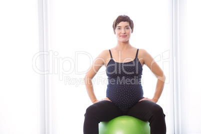 Pregnant woman keeping in shape