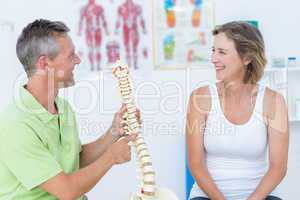 Doctor showing anatomical spine