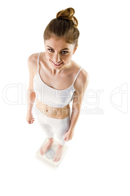 Slim woman standing on scales