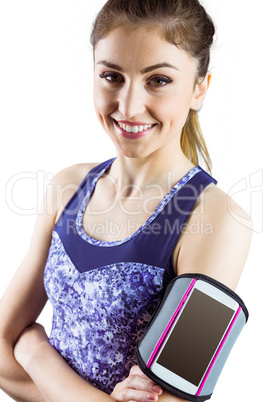 Fit woman using smartphone in armband