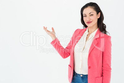 Elegant brunette presenting with her hand