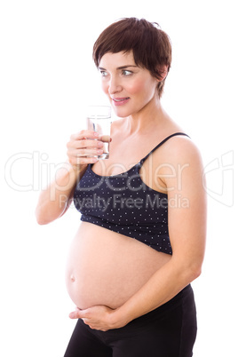 Pregnant woman drinking glass of water