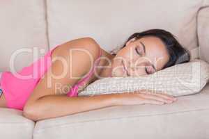 Pretty brunette relaxing on the couch