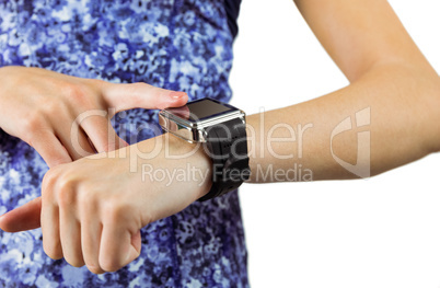Fit brunette using her smartwatch