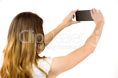 Woman taking a selfie on smartphone