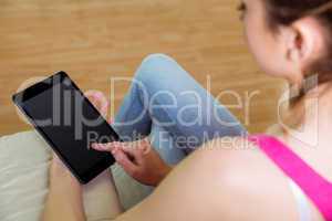Casual woman using her tablet pc