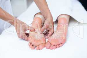 Physiotherapist doing foot massage