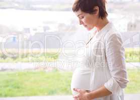 Pregnant woman holding her bump