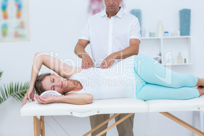 Doctor massaging his patient