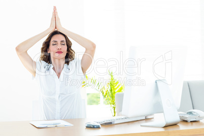 Relaxed businesswoman doing yoga