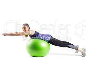 Fit woman exercising on exercise ball