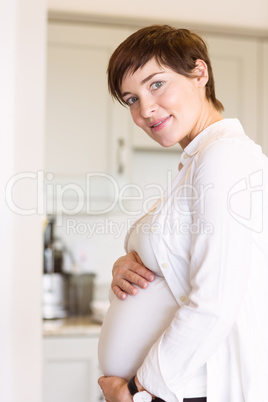 Pregnant woman holding her bump