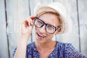 Pretty blonde woman wearing hipster glasses