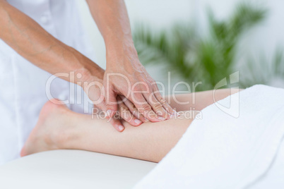 Physiotherapist doing leg massage