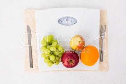 Weighing scales with fruits