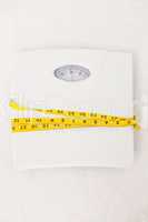 Weighing scales with measuring tape around