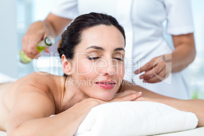 Smiling woman getting an aromatherapy treatment Smiling woman getting an aromatherapy treatment