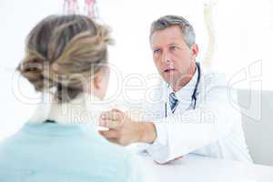 Doctor checking neck brace of his patient