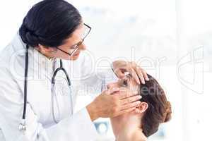 Doctor checking her patients eyes