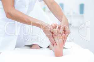 Physiotherapist doing foot massage