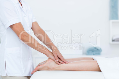 Physiotherapist doing foot massage