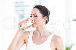 Brunette drinking water