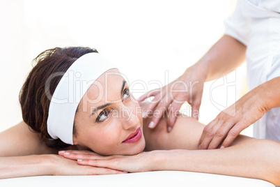 Beautiful brunette having back massage