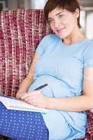Pregnant woman listing baby names