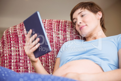 Pregnant woman using tablet pc