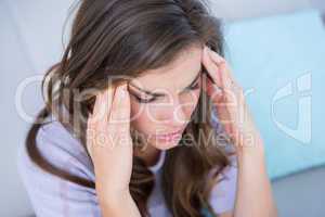 Sick woman suffering from head ache