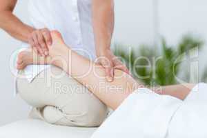 Physiotherapist doing leg massage