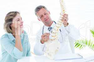 Doctor pointing anatomical spine