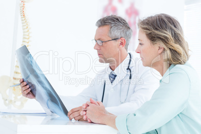 Doctor showing xray to his patient