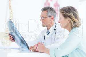 Doctor showing xray to his patient