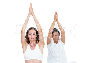 Relaxed women raising arms