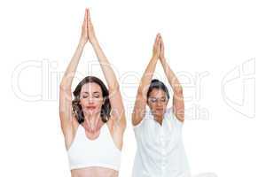 Relaxed women raising arms