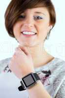Pretty brunette wearing her smartwatch