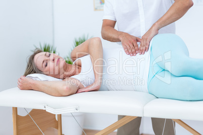 Doctor massaging his patient stomach