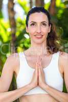 Smiling woman doing yoga