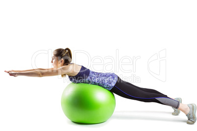 Fit woman exercising on exercise ball