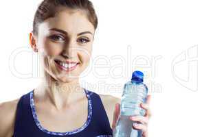 Fit brunette holding water bottle