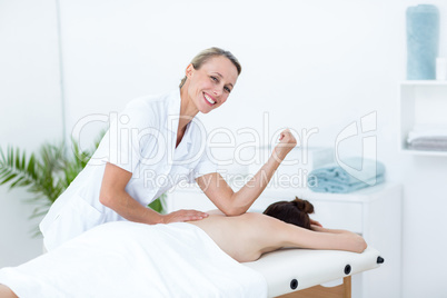 Physiotherapist doing back massage