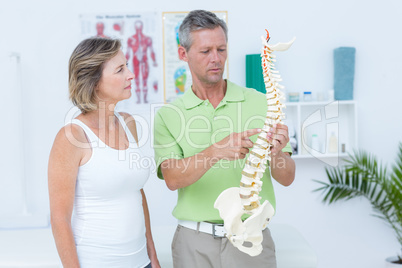 Doctor showing anatomical spine