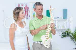 Doctor showing anatomical spine